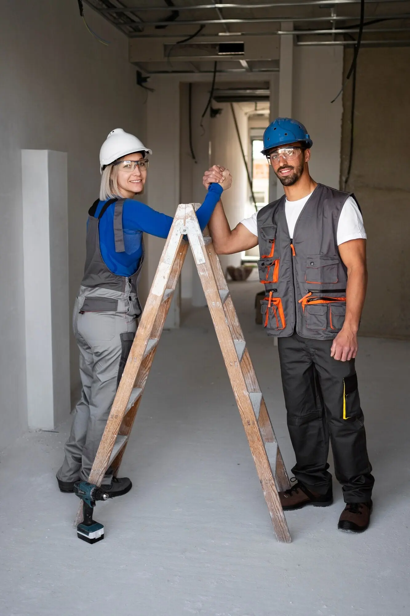 Full-length shot of smiling people holding hands.