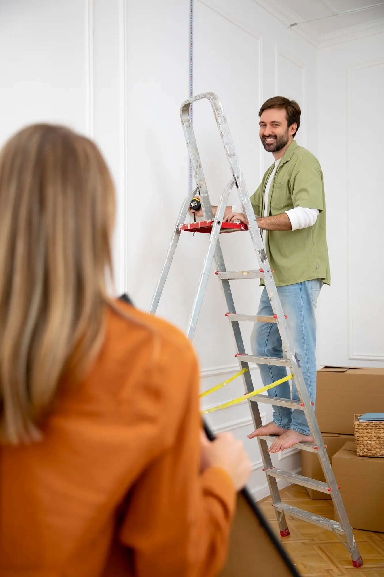 A young couple moving into a new home